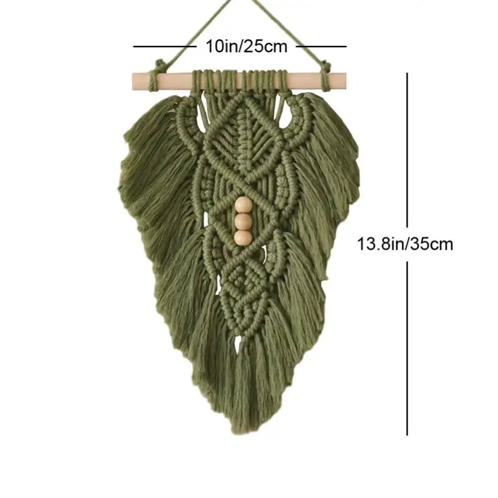 Handmade macrame leaf wall hanging in olive green with wooden beads and fringe for off-white bedroom decor