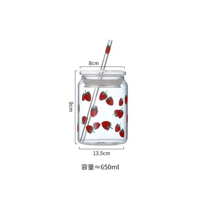 Handmade pink glass cup set featuring a clear glass cup with red strawberry decorbites and matching transparent lid and straw