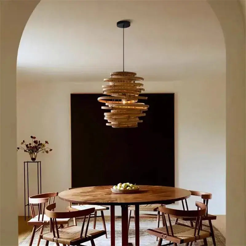 A warm-toned layered rattan decorbites bamboo birdnest pendant light with spiral design for bedroom decor