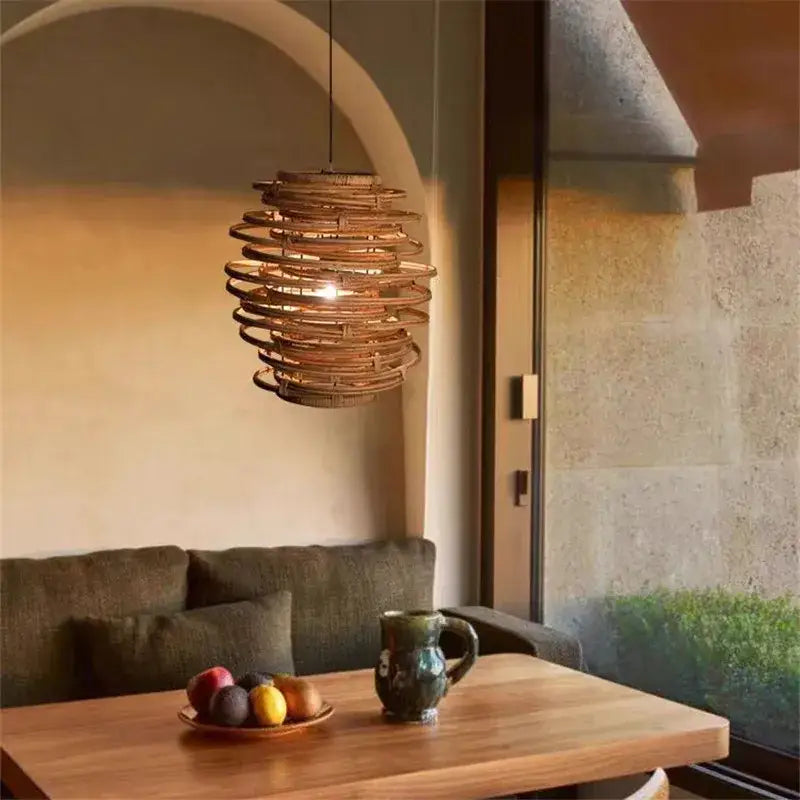 Handmade warm-toned spiral bamboo birdnest pendant light by decorbites for bedroom decor and lighting