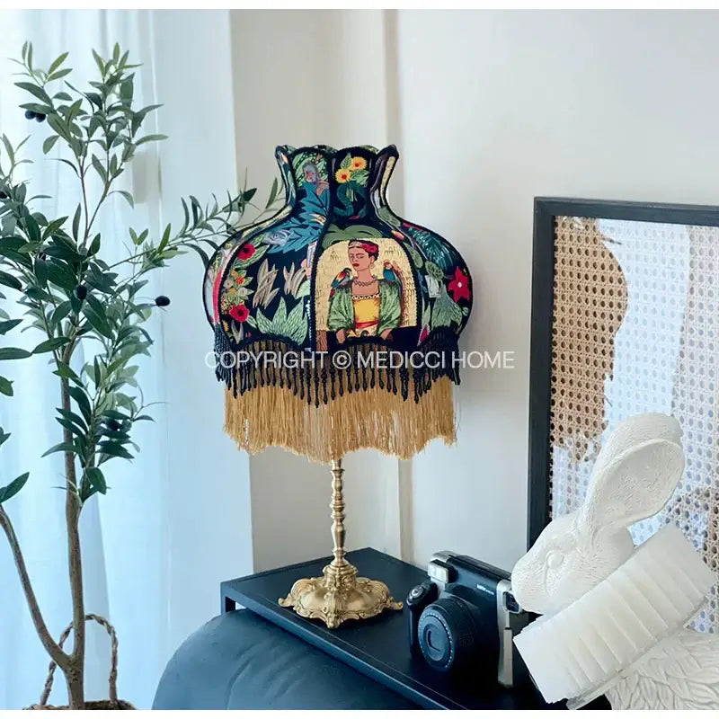Handmade vintage jungle lampshade featuring a dark embroidered shade with frida kahlo and golden fringe decorbites handmade vintage