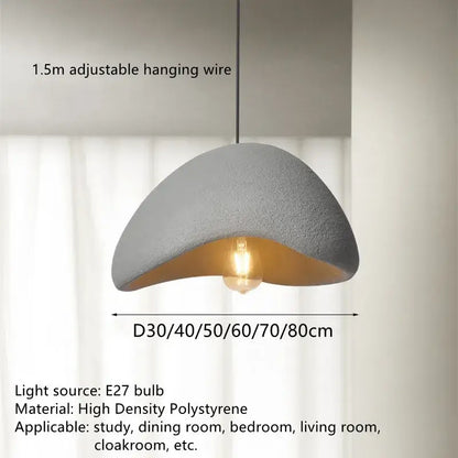Gray semi-circular handmade wabi sabi pendant lamp with textured surface and gold interior for dining room lighting decorbites