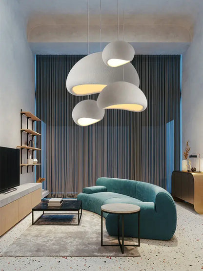 Teal velvet curved sofa paired with decorbites handmade wabi sabi off white pendant lamp for elegant dining room lighting