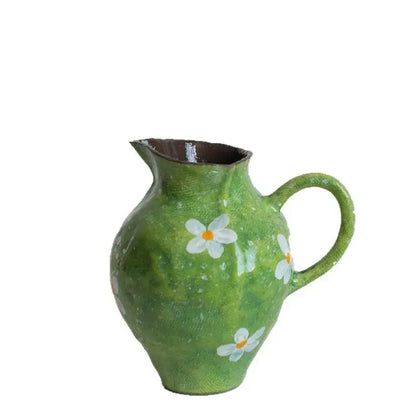 Handmade green ceramic watercolor flower vase with hand-painted white daisies and rustic textured surface for decor