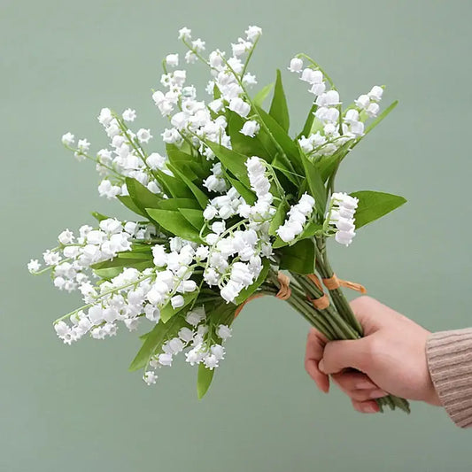 Handmade white bellflower artificial flowers bouquet with delicate lily-of-the-valley blooms for wedding decor by decorbites