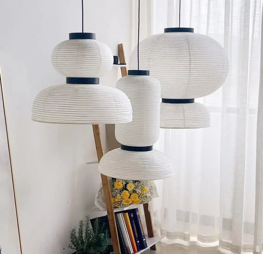 Handmade white paper chandelier with black rims hanging from the ceiling for dining room decorbites handmade white design