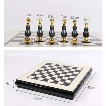 Handmade wooden chess set with black and gold glossy sculpted pieces on a foldable checkered board for games room decor