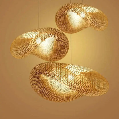 Three golden woven bamboo chandelier pendant lights with a modern swirling design for dining room decorbites bamboo chandelier