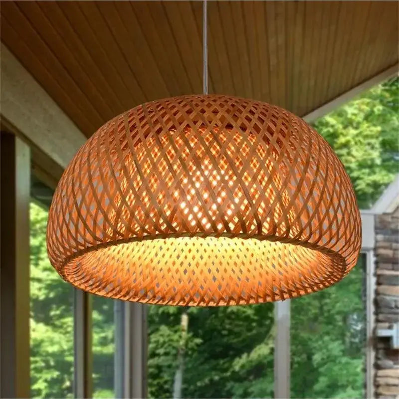 Handwoven beige tone bamboo pendant light with a warm woven dome design made of natural materials for dining room