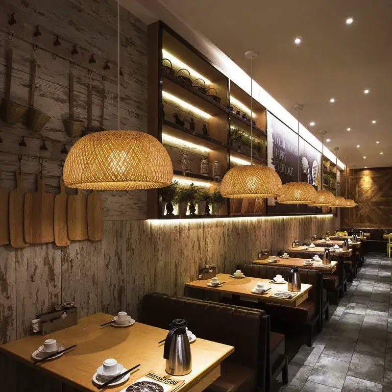 Handwoven beige bamboo dome pendant light with warm natural glow made from natural materials for dining room