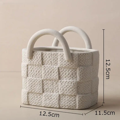 White ceramic decorbites handwoven ceramic basket planter with woven texture and curved handles for living room decor