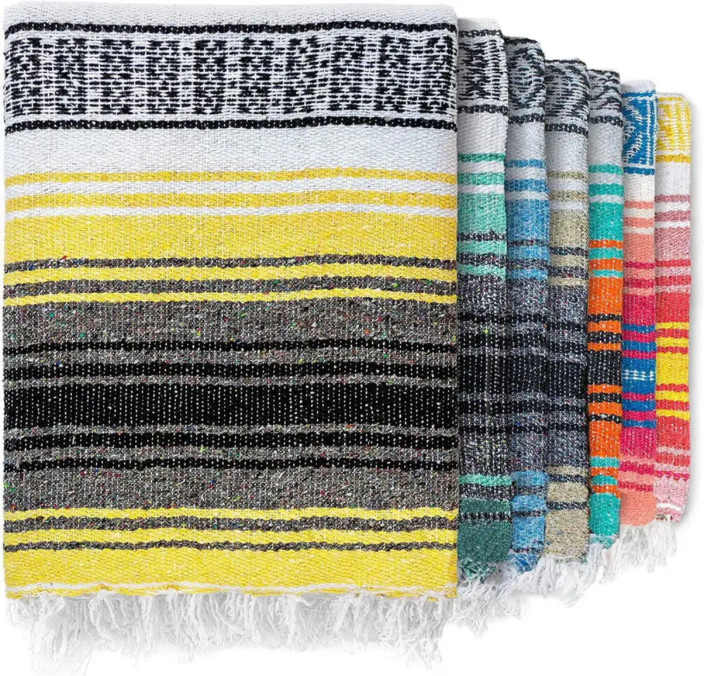 A decorbites handwoven mexican blanket with vibrant yellow black gray and white stripes and fringed edges for decor