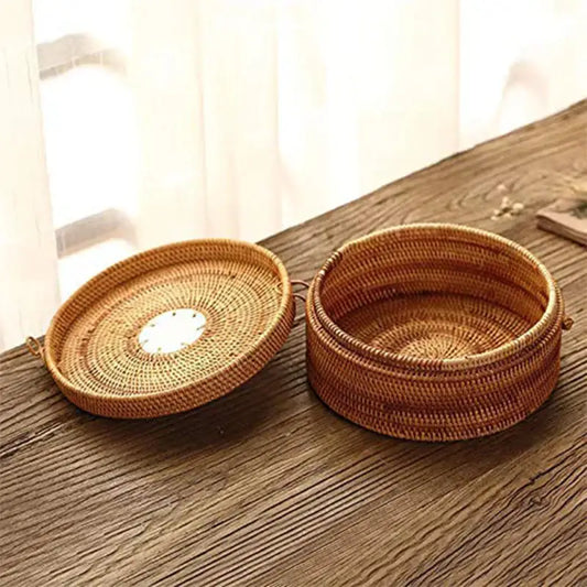 Handwoven rattan storage box with white circular inset lid for kitchen decor by decorbites handwoven rattan