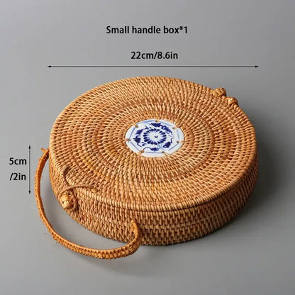 Handwoven rattan storage box with round handle and blue white ceramic tile centerpiece by decorbites storage box