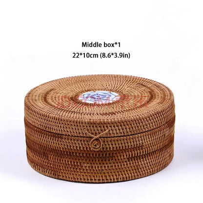 Handwoven rattan storage box by decorbites with round brown woven design and decorative blue and white ceramic disc