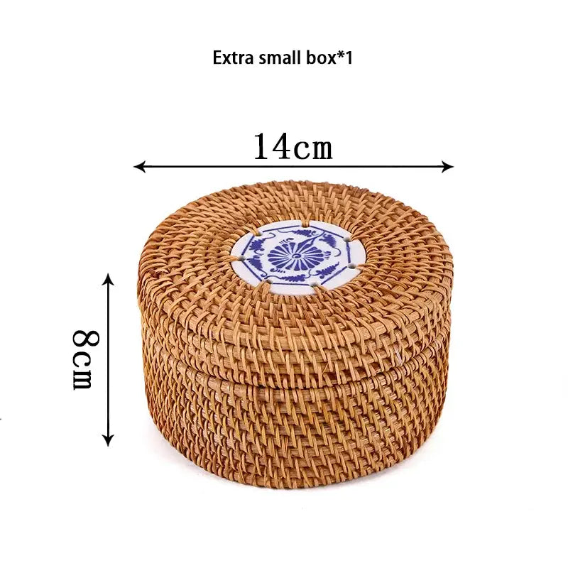 A round extra small handwoven rattan storage box with a blue and white ceramic lid by decorbites
