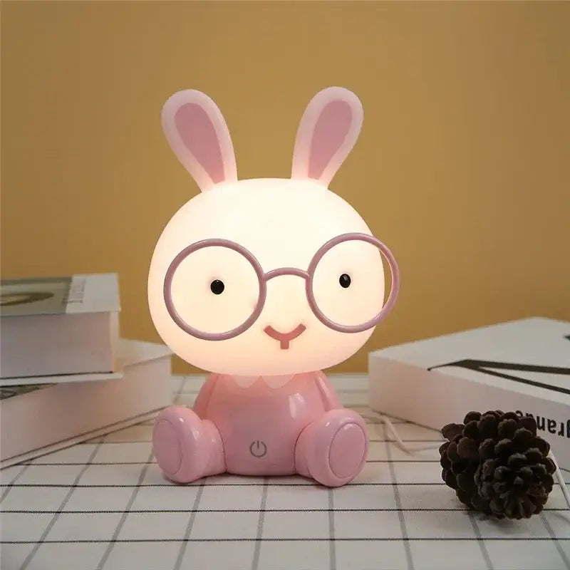Pink rabbit-shaped night light with round glasses and smiling face from hellokitty decorbites cartoon animal night light