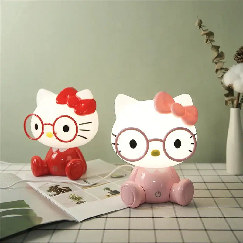Two hello kitty cartoon animal night lights in red and pink with bows and glasses for bedroom decorbites night light