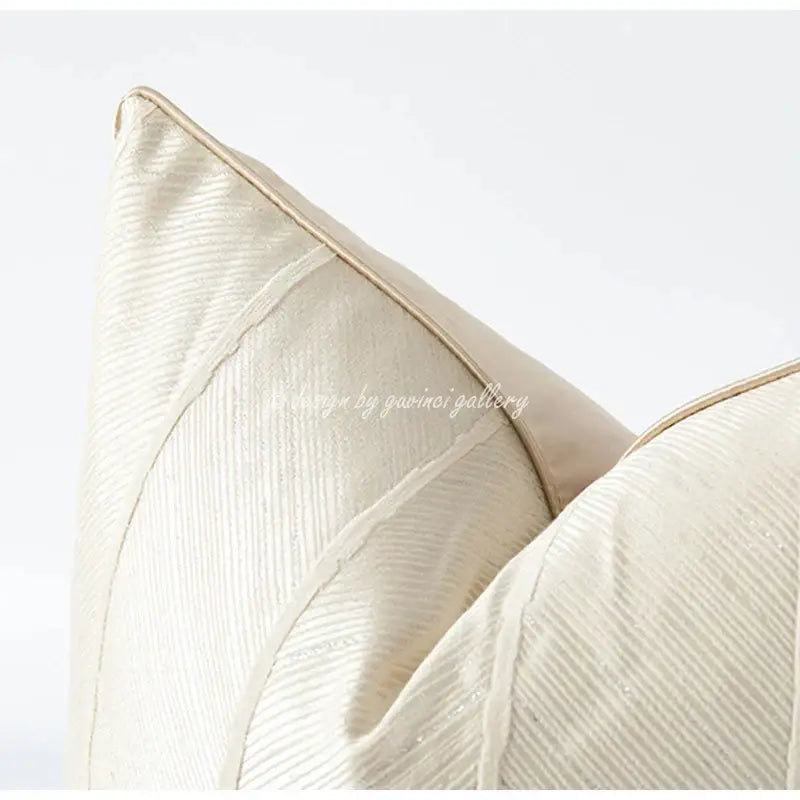 Cream-colored herringbone jacquard cushion cover with subtle ribbed texture and matching stitched edges for living room decor