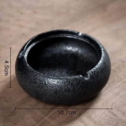 Hexagonal black pottery ashtray by decorbites with black speckled ceramic bowl and slightly raised rim for living room decor