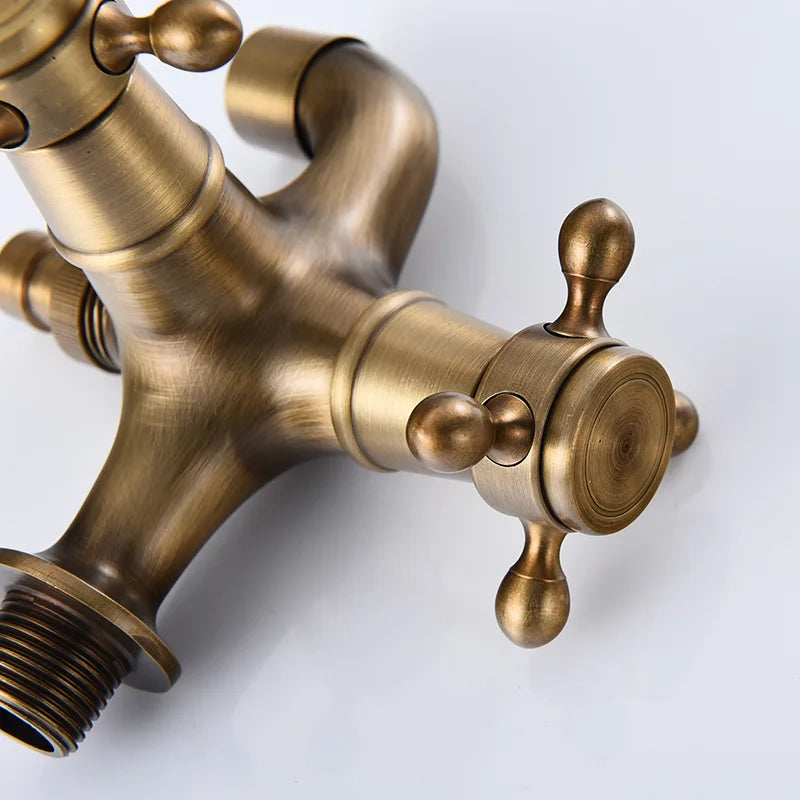 Antique brass-finished three-handle total brass bathroom faucet with ornate knobs for washing machine and garden use