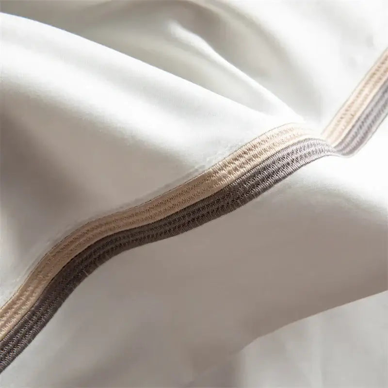 White satin pillowcase with beige and dark gray ribbed trim from decorbites 1000tc egyptian cotton bedding set