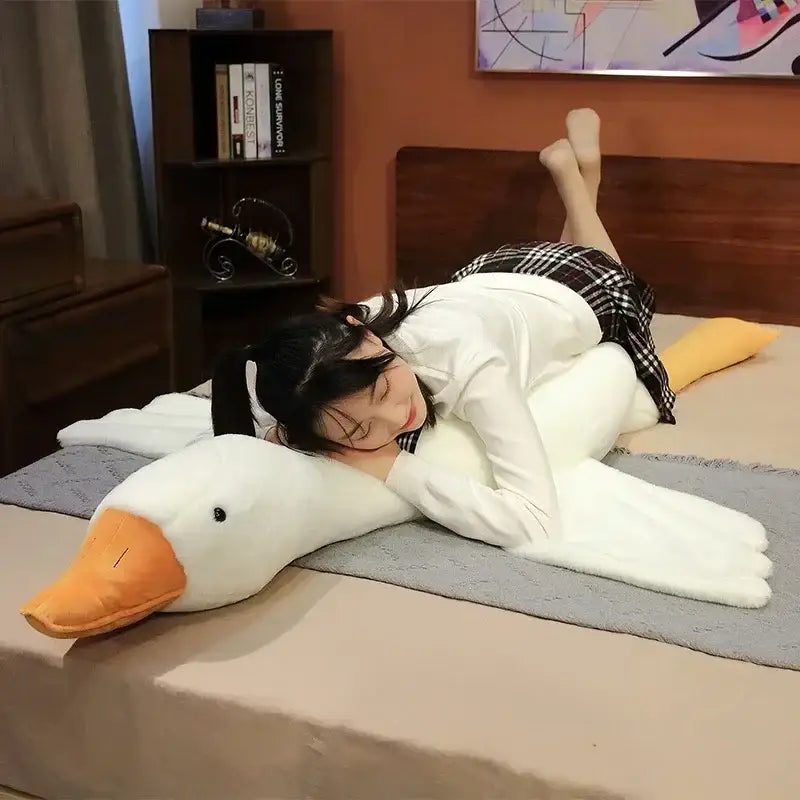 A plush white huge goose body pillow with orange beak and feet made of soft fabric for bedroom decorbites huge goose decor