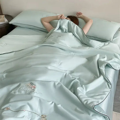 Light blue satin duvet set with subtle embroidery and black piping from decorbites ice rayon summer quilt collection