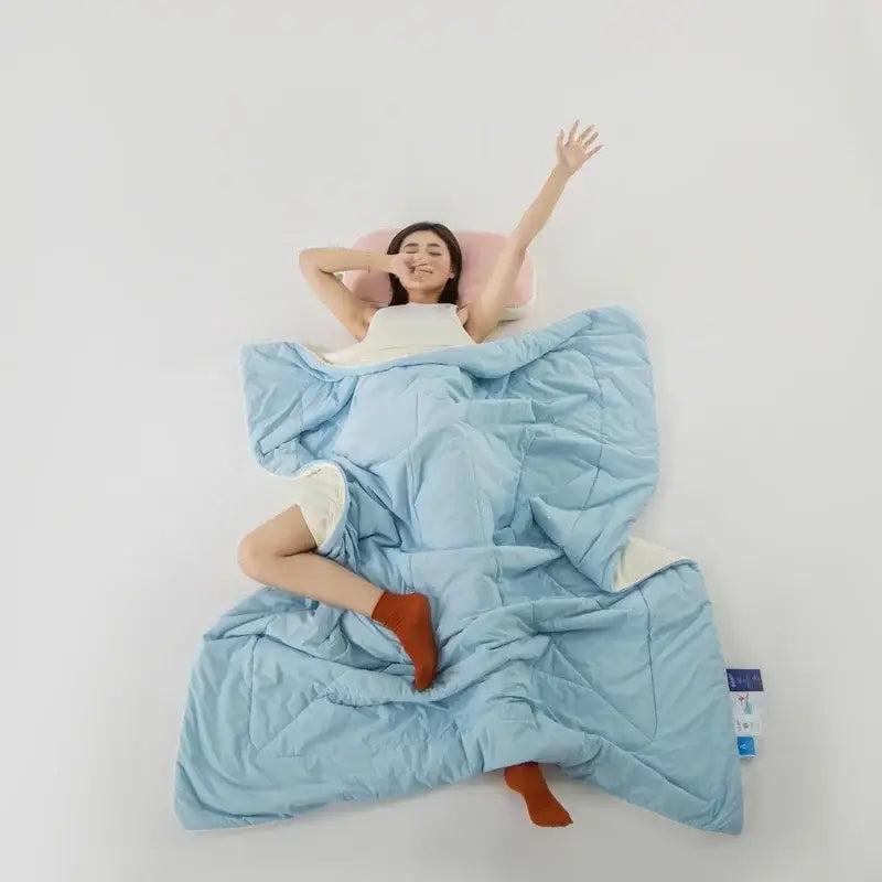 Light blue decorbites ice silk cooling blanket with quilted plush texture and white inner lining for bedroom comfort