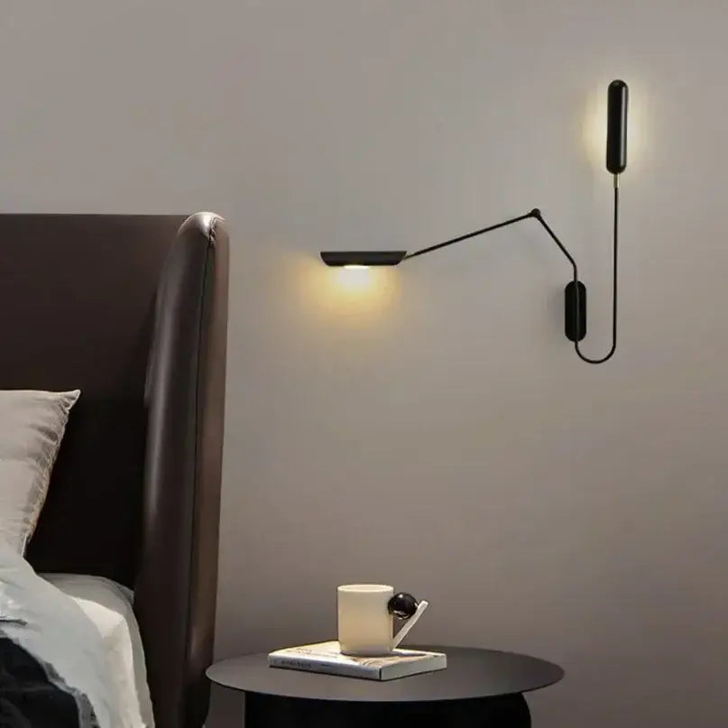 Black minimalist industrial adjustable led wall lamp with articulated arm emitting warm light for bedroom reading decorbites industrial adjustable