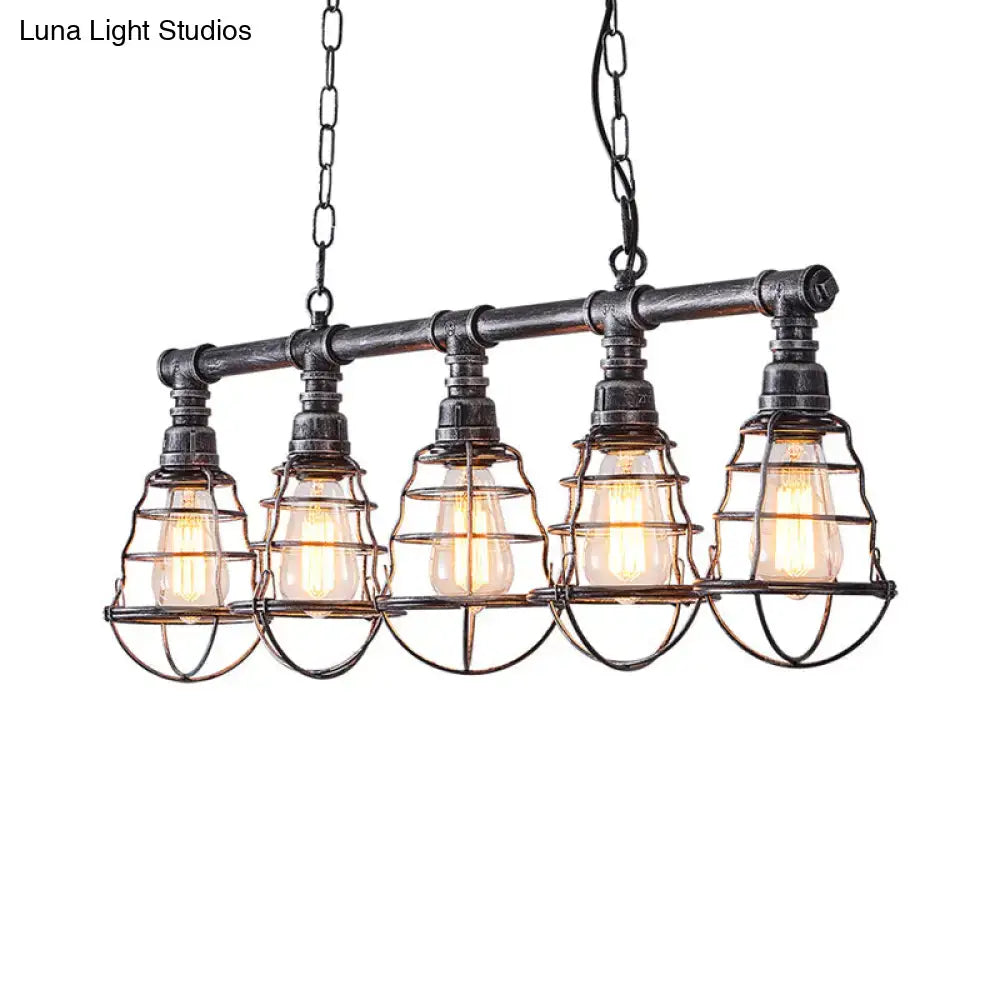 Industrial aged silver metal caged island light with black metal pendant and five exposed edison bulbs for dining room use