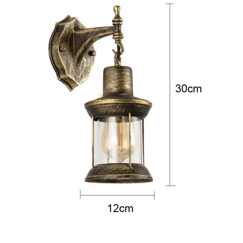 Industrial antique brass wall lamp with clear glass lantern and visible filament bulb for decorbites industrial glass wall decor