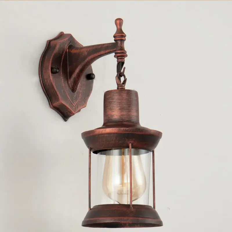 Antique bronze finished wall lamp with clear glass enclosure and exposed filament bulb for decorbites industrial glass wall use