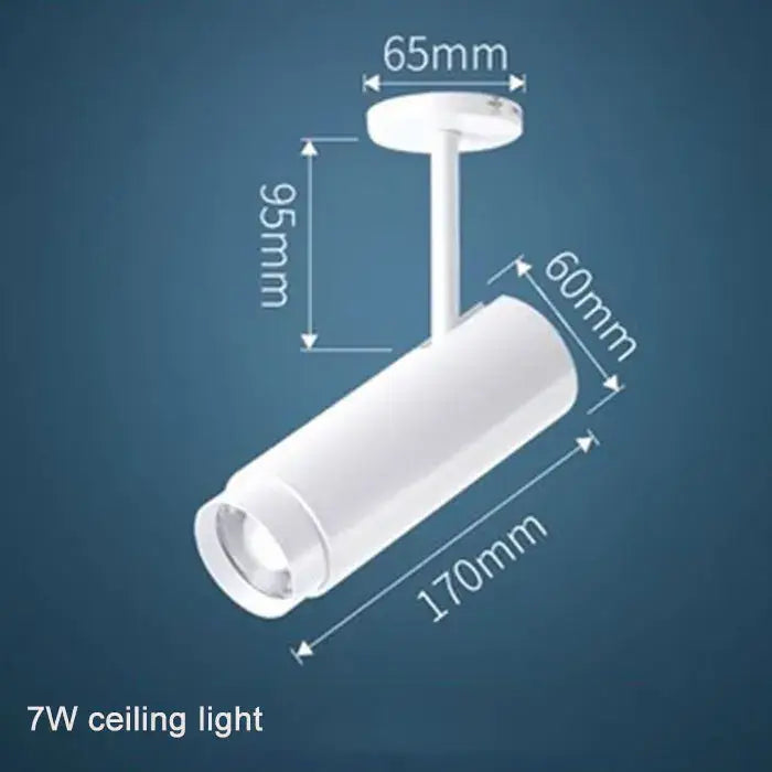 White cylindrical 7w ceiling track spotlights with adjustable focus and precise dimensional markings by decorbites