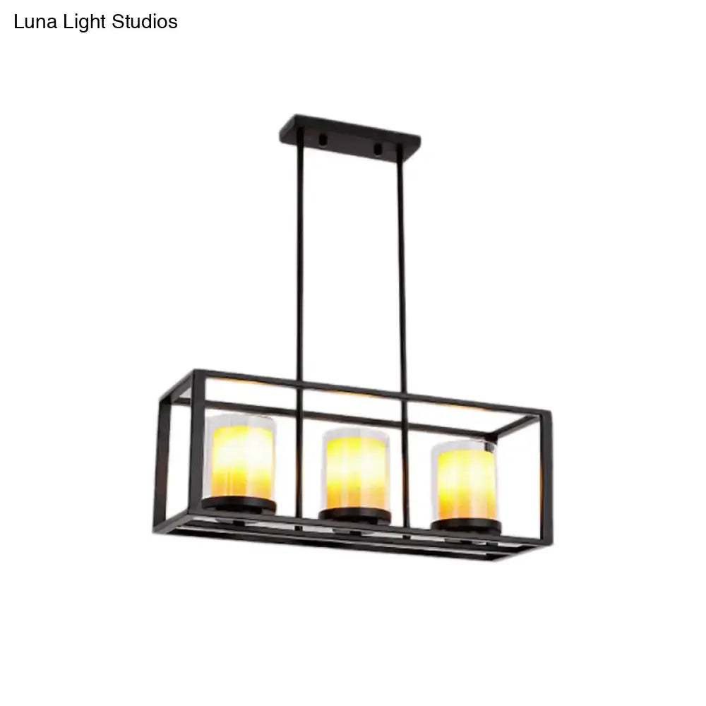 Black metal rectangular light fixture with three warm yellow glass candle bulbs for amber cylinder island lighting