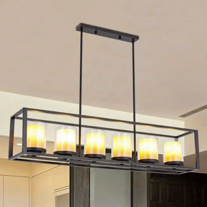 Black metal rectangular light fixture with five warm yellow glass candle bulbs for amber cylinder island lighting