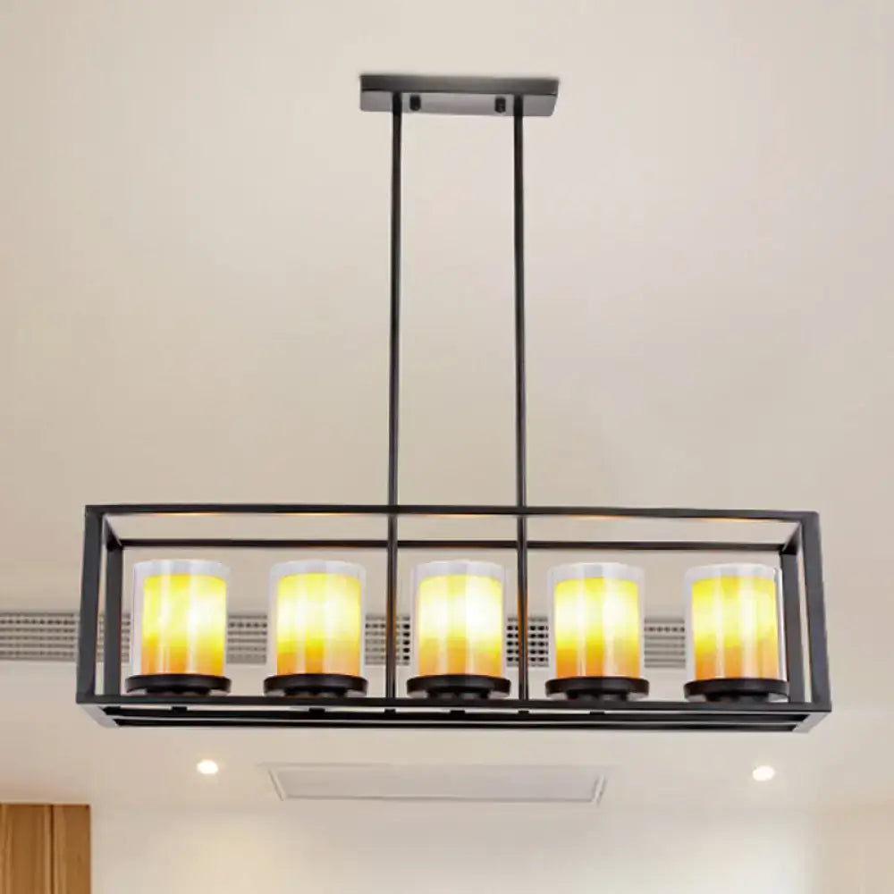 Black metal rectangular light fixture with five warm yellow glass candle bulbs for amber cylinder island lighting