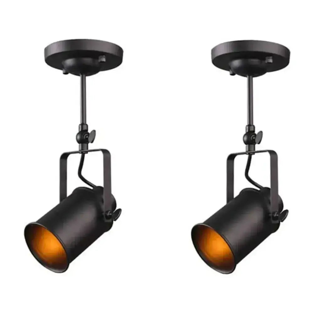 Industrial black and amber adjustable ceiling lamp with matte finish and warm interior lighting for dining room decorbites industrial vintage style