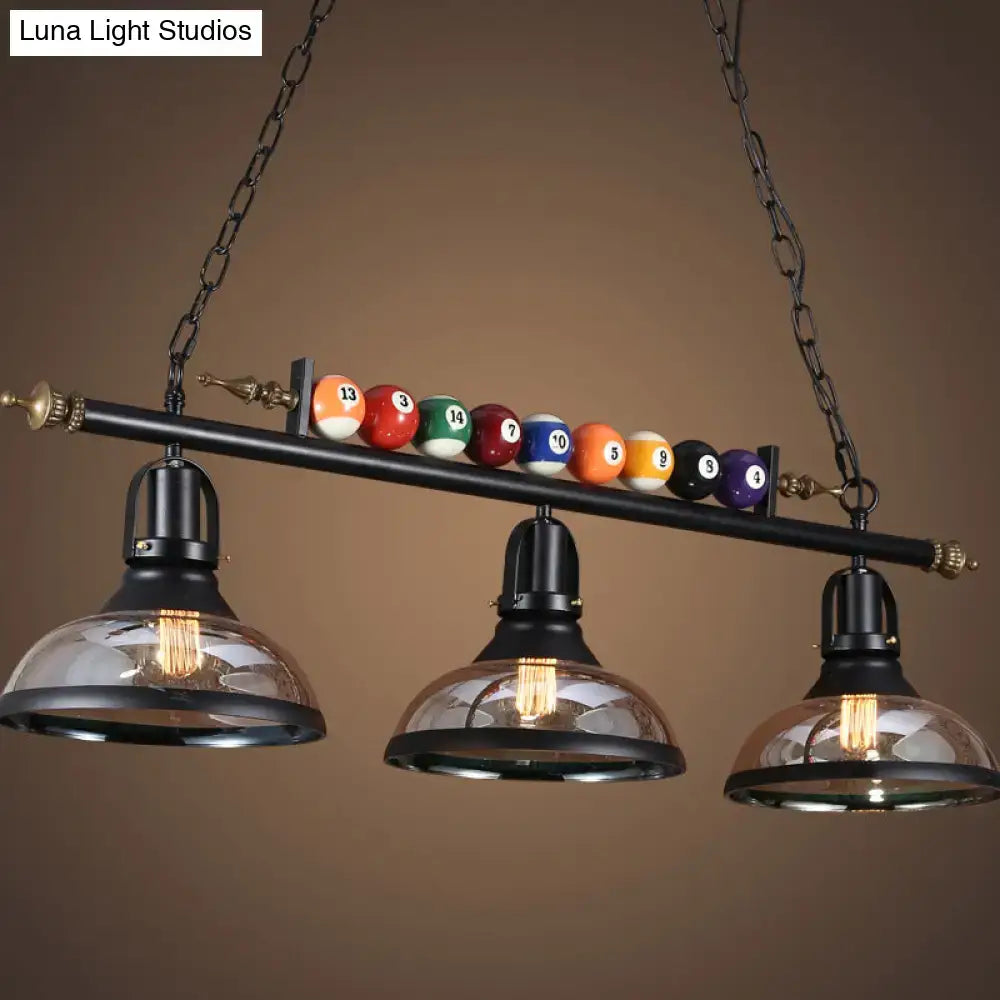 DecorBites™ industrial style hanging light with black metal finish and billiard ball deco featuring three glass domes