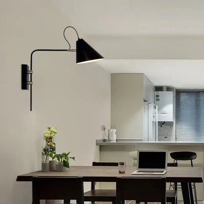 Black wall light with a brass swing arm and conical shade for industrial vintage decorbites living room lighting