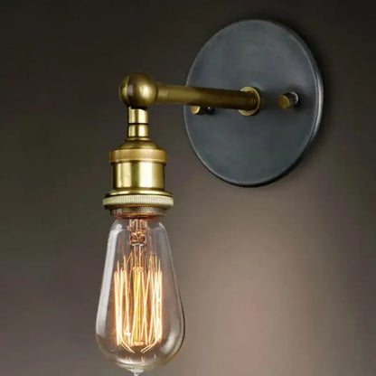 Brass-finished industrial led wall light with dark matte metal backplate and exposed filament bulb for bedroom decorbites industrial led wall