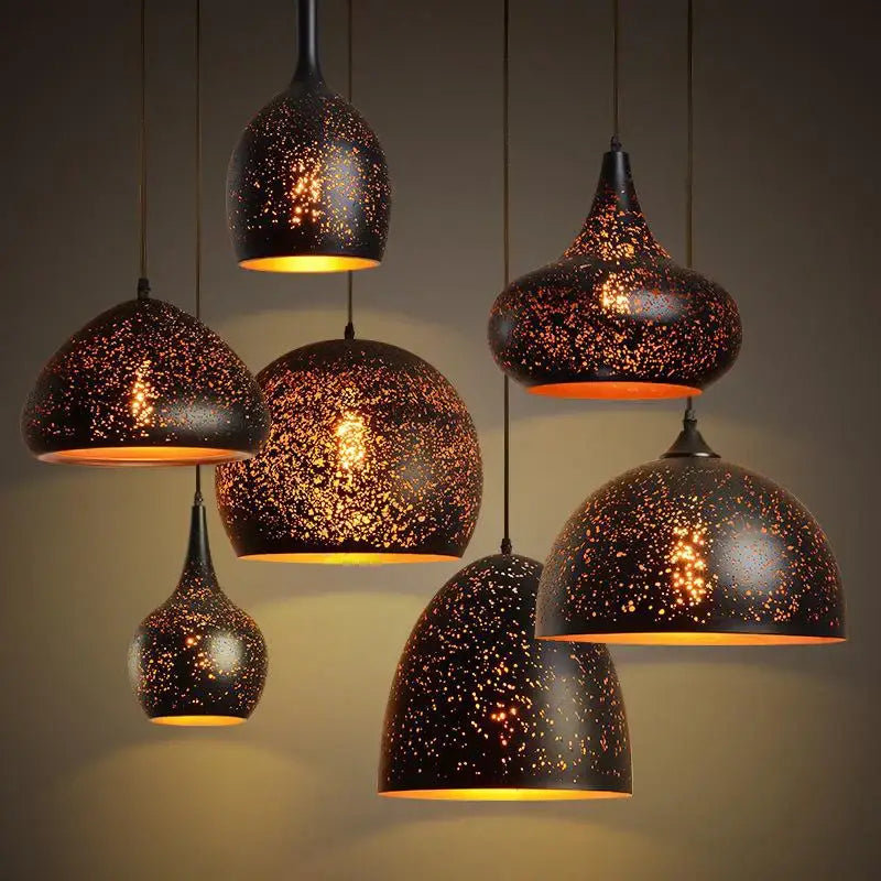 Industrial black and gold etched wrought iron chandelier with black metal pendant lights and warm amber glow for dining room decorbites etched wrought