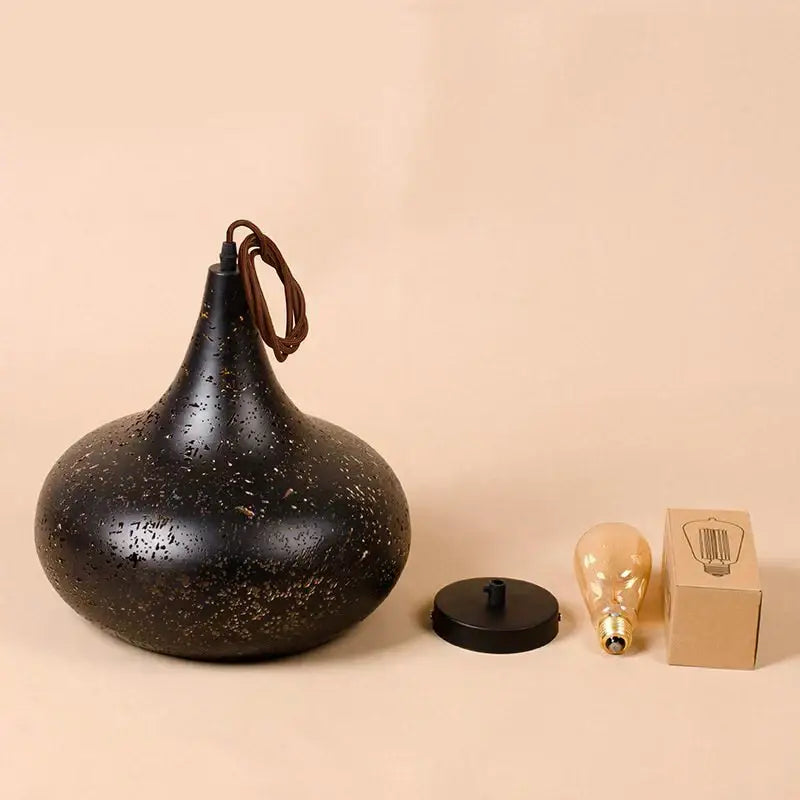 Black speckled pendant lamp with matte finish and braided cord in decorbites etched wrought iron chandelier style