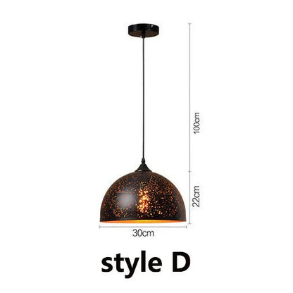 Industrial black and gold etched wrought iron chandelier featuring a dark bronze dome pendant light with textured surface