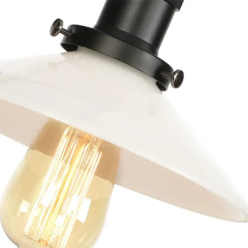 Industrial black and white wall light fixture with white ceramic pendant and exposed edison bulb for bedroom sconce