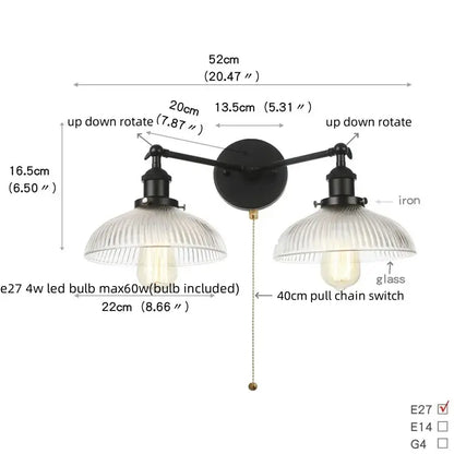 Industrial black iron wall light fixture with two ribbed glass shades and pull chain switch for bedroom use