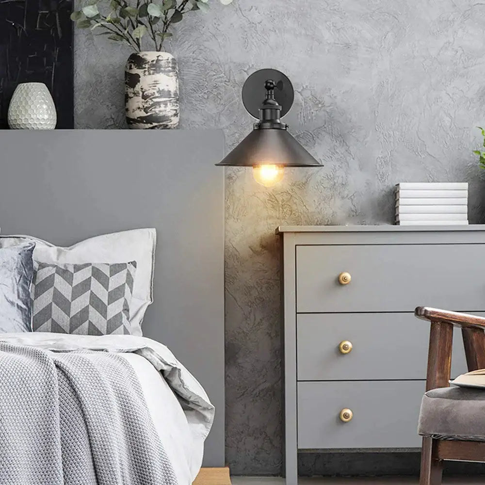 Black metal industrial wall sconce with conical shade and exposed bulb for bedroom decorbites industrial wall lighting