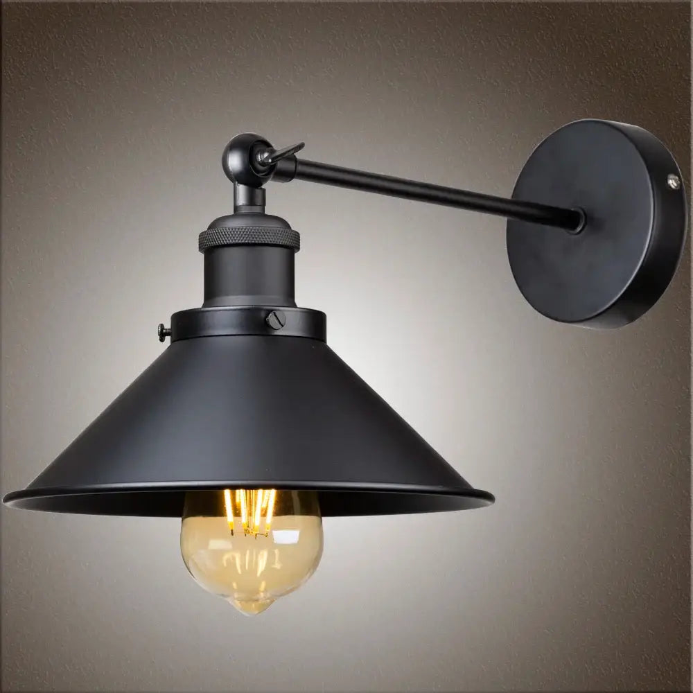 Black industrial wall sconce with matte metal shade and exposed Edison bulb for bedroom decorbites industrial wall lighting