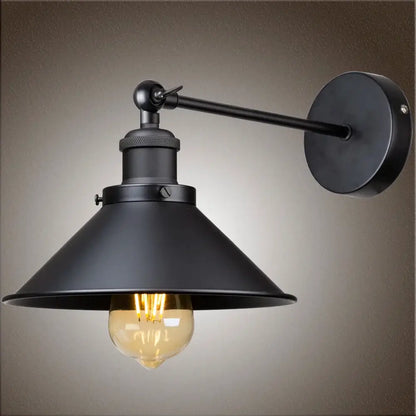 Black industrial wall sconce with matte metal shade and exposed Edison bulb for bedroom decorbites industrial wall lighting