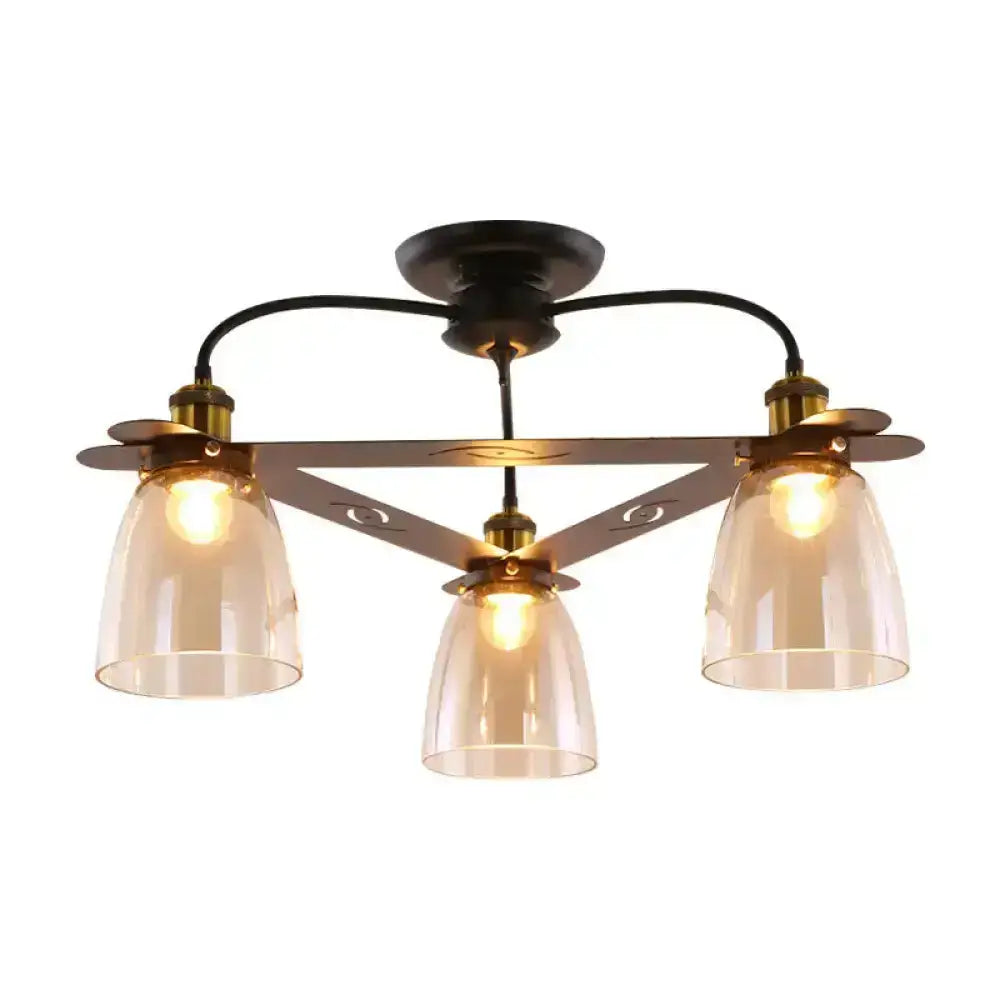 Black metal ceiling lamp with three cognac glass bell shades and brass accents for living room lighting